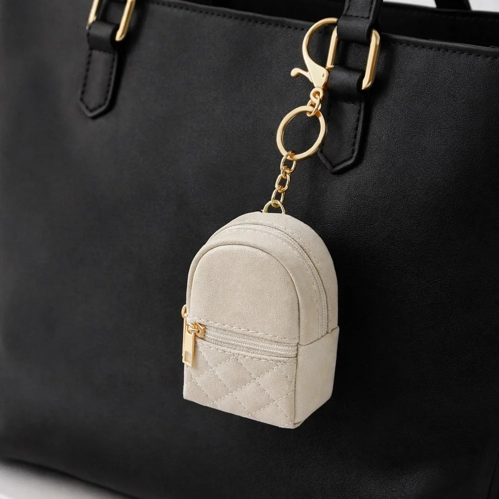 Mini Cream Backpack Keychain with Gold Accents